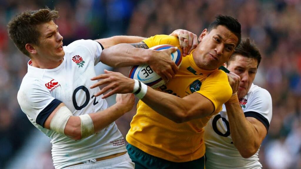 England’s Joel Tomkins (right) and Owen Farrell tackle Australia’s Israel Folau at Twickenham earlier this month. Photograph: Reuters