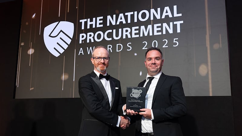 Michael Walls, awards judge, presents the best private sector procurement project of the year award to Gary Rooney, PTSB & Efficio.