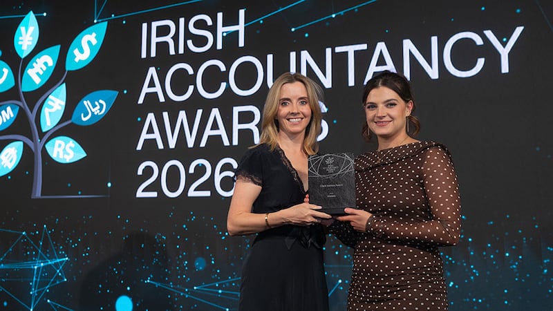 Roseann Heavey, director of ETL Global Ireland, presents the client service award to Orlagh Shine, Incorpro