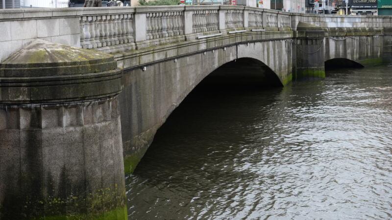 Butt Bridge:  Repairs are needed to the parapets and cracks have been identified in the surface and in the support structures. Photograph: The Irish Times