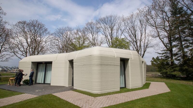 An exterior view of the two-bedroom bungalow resembling a boulder with windows in Eindhoven, the Netherlands. Photograph: Peter Dejong/AP