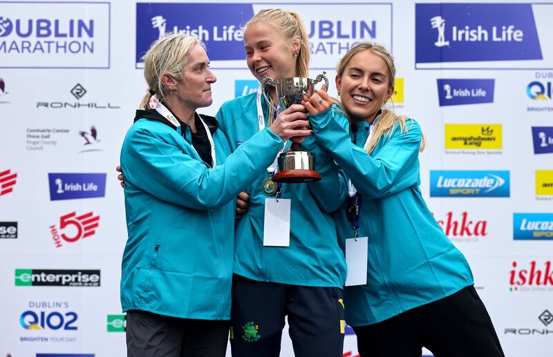 Women's national title winner Ava Crean celebrates with second-place finisher AnnMarie McGlynn of Strabane AC and third-place finisher Nichola Sheridan of Bohermeen AC. Photograph: Bryan Keane/Inpho