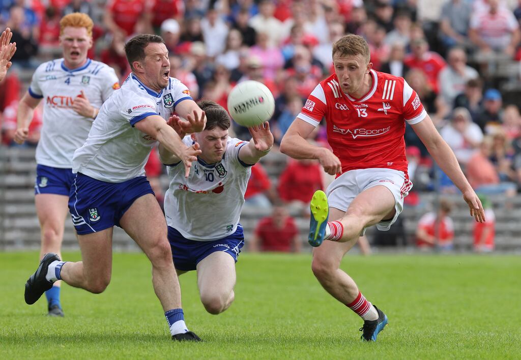 Monaghan’s Ryan Wylie and Stephen O’Hanlon tackle Ryan Burns of Louth. Photograph: Lorraine O’Sullivan/Inpho
