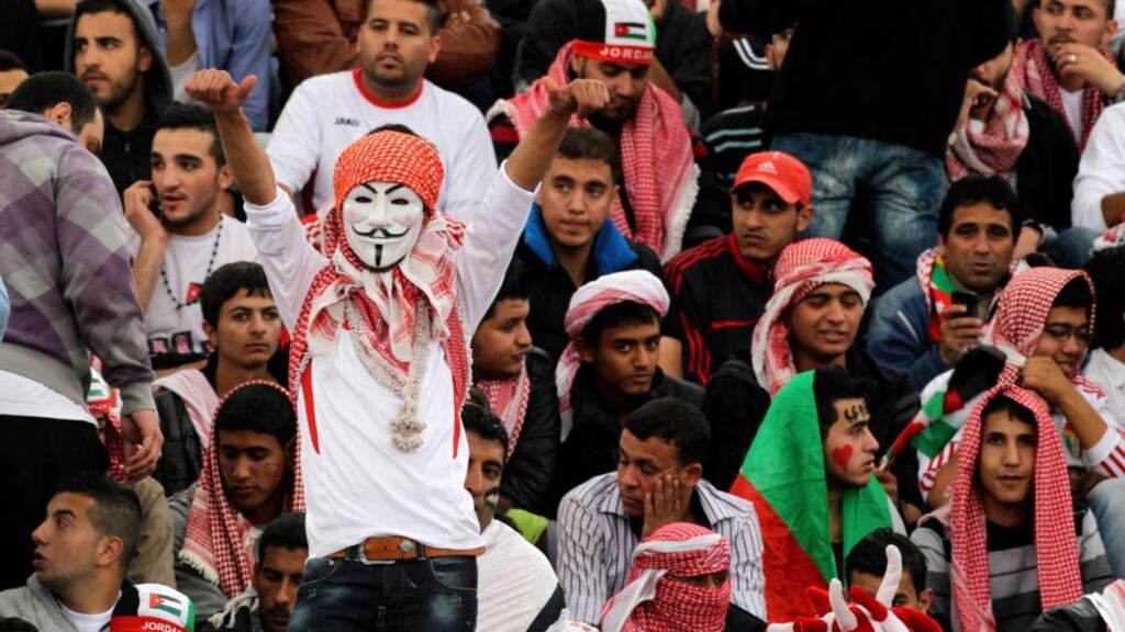 A Jordanian fan keeps the faith during today’s World Cup play-off against Uruguay. Photograph: Muhammad Hamed/Reuters