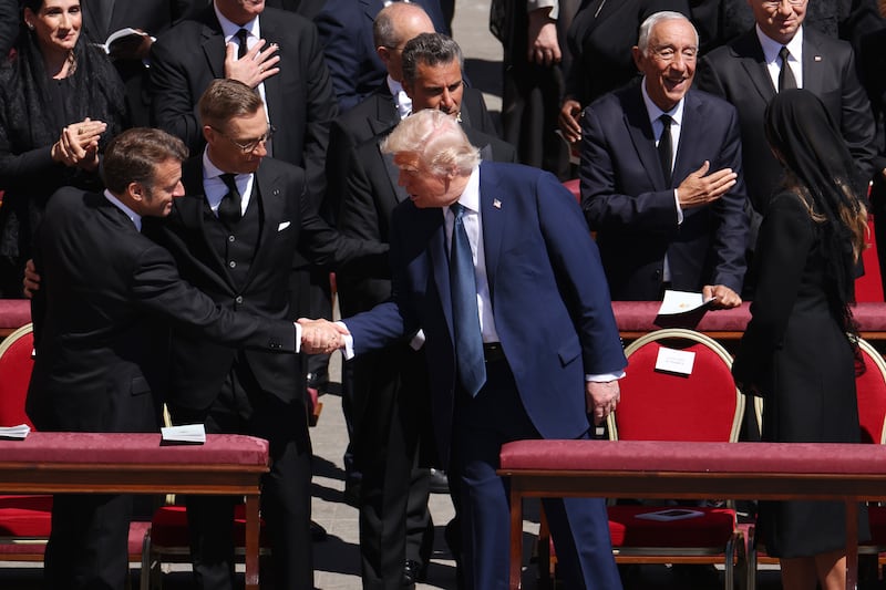 France's President Emmanuel Macron and US President Donald Trump shake hands during the funeral mass. Photograph: Dan Kitwood/Getty Images