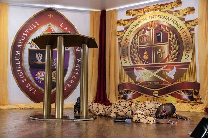 Bishop Lamor Whitehead re-enacts the robbery he had a week before. Photograph: Victor J. Blue/The New York Times