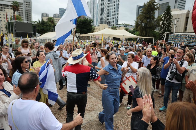 People celebrate after a peace deal is announced at Hostages Square in Tel Aviv, Israel, 09 October 2025. Photograph: Abir Sultan/European Pressphoto Agency