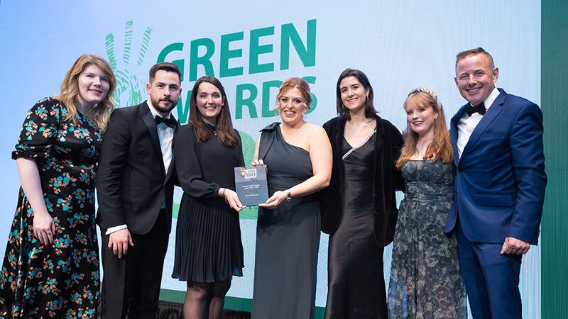 Sonya Mallon, company secretary, Bord na Móna, presents the Sustainability Team of the Year - SME award to the Ethos Engineering team.