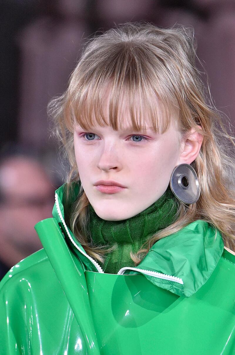 A model wears a green jumper and jacket  at  Marni’s autumn/winter 2018-2019 fashion show in Milan. Photograph:  Victor Virgile/Gamma-Rapho via Getty Images