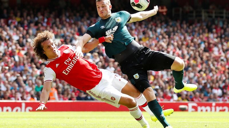 David Luiz battles with Chris Wood on his Arsenal debut. Photograph: David Klein/Reuters