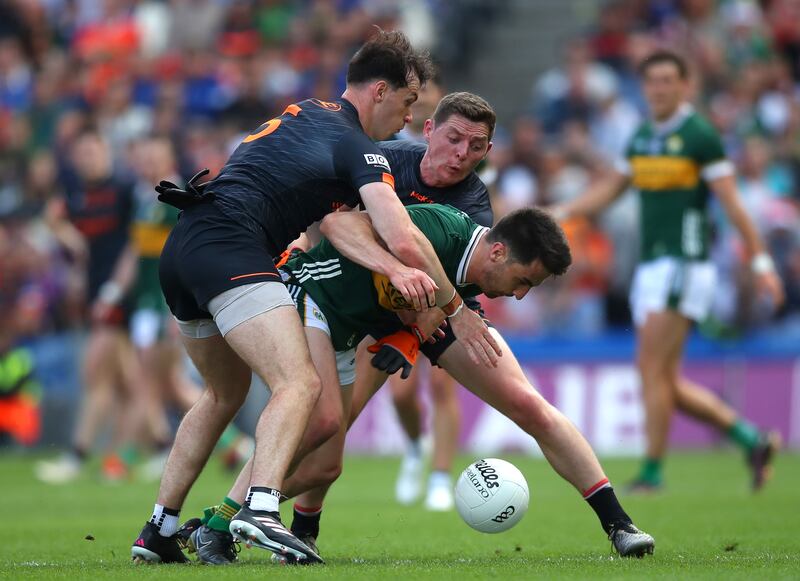 Armagh's Barry McCambridge and Paddy Burns tackle Brian Ó Beaglaoich of Kerry at Croke Park. Photograph: Leah Scholes/Inpho 