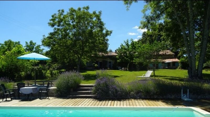 Dordogne in France: a three-bedroomed farmhouse and a two-bedroom guest house with a lawn that runs down to a swimming pool