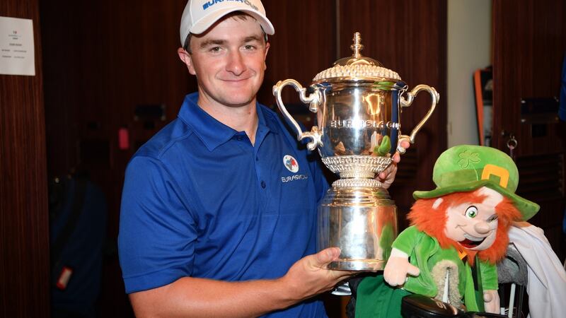 Ireland’s  Paul Dunne  celebrates with the trophy after Europe’s win in the  EurAsia Cup. Photograph: Stuart Franklin/Getty Images