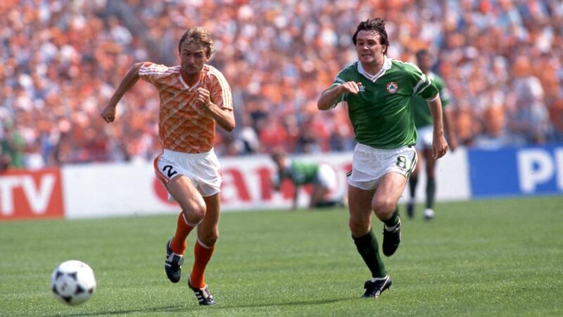 Euro 88: Adri van Tiggelen and  Ray Houghton during Ireland’s Netherlands match. Photograph: Billy Stickland/Inpho