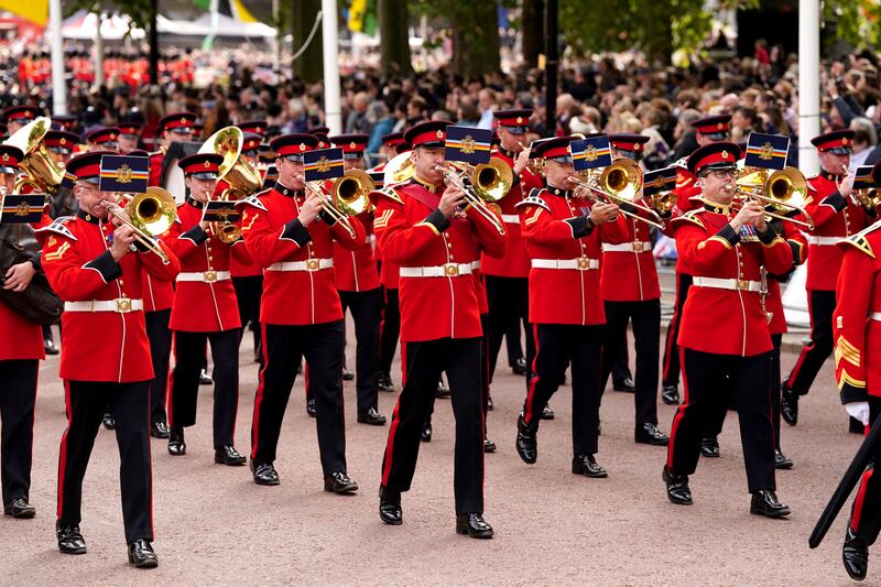 Members of a military marching band in the coffin procession walk down Horse Guards Road following the state funeral of Queen Elizabeth II at Westminster Abbey, London. 