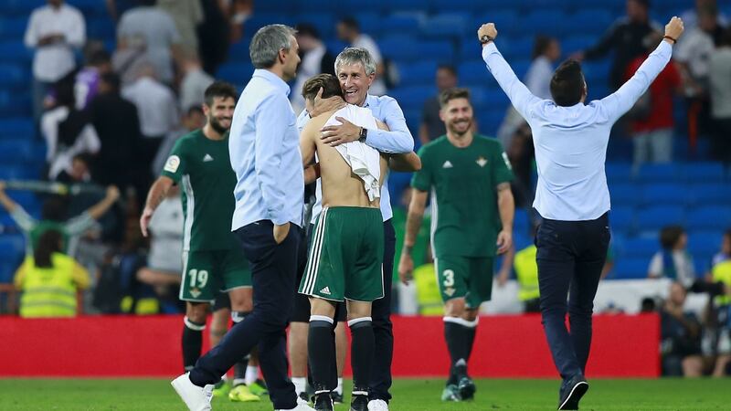 Real Betis coach  Quique Setien celebrates with his players after the win over Real Madrid. Photograph: Gonzalo Arroyo Moreno/Getty Images