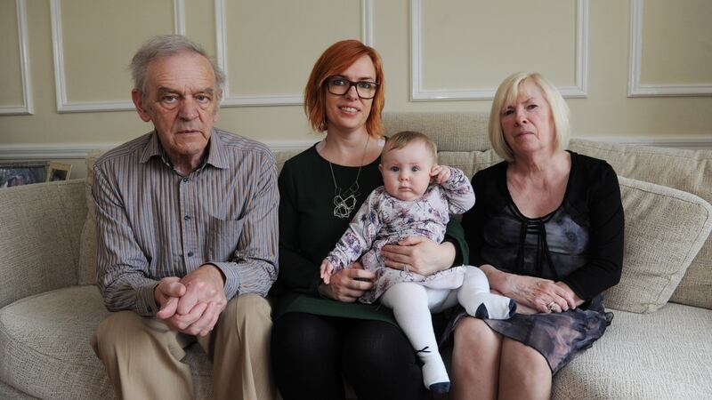 Lorraine Carthy with her daughter Tess aged 9 months and her parents Aidan and Phylis Carthy, in their home in Sandyford, Dublin. Photograph: Aidan Crawley