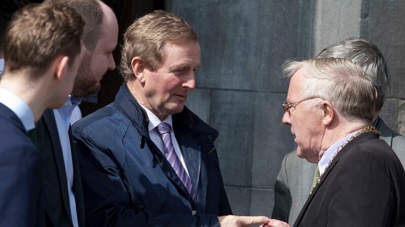 Acting Taoiseach Enda Kenny (centre) and  Cllr Christy Burke (right) at the funeral of Martin O’Rourke who was shot dead in a case of mistaken identity by a hired gunman in a gang-related attack in Dublin. Photograph: RollingNews.ie