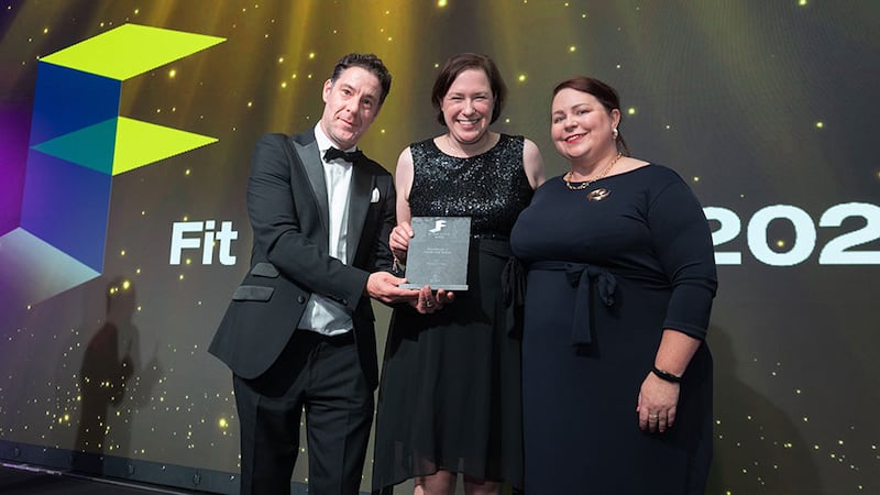 Diarmuid Condon, managing director at DCON Safety Consultants, presents the excellence in health and safety award to Fiona O'Reilly and Deirdre Gingles, Structure Tone
