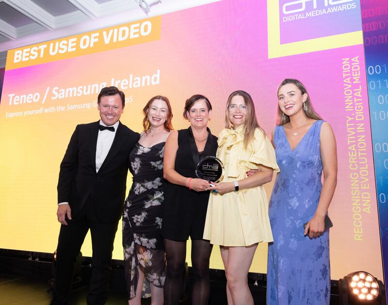 MC Anton Savage presents the award for Best Use of Video to members of the team from Teneo. Photograph: Paul Sherwood