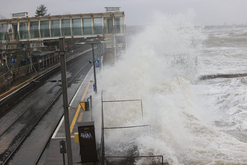 Waves crash over Blackrock dart station.