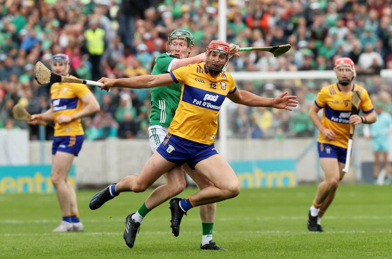 Limerick's William O'Donoghue and Clare's Peter Duggan battle it out in the Munster final at Thurles. Photograph: Bryan Keane/Inpho
