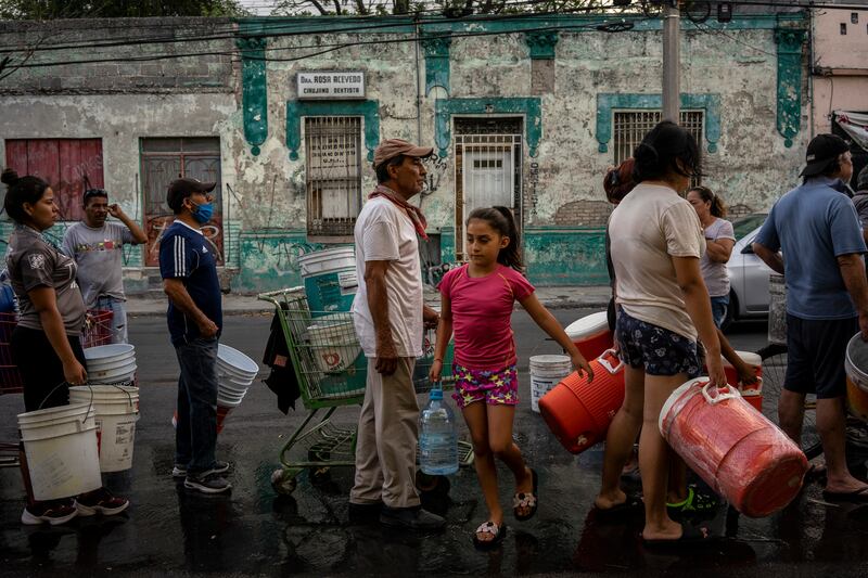 Residents line up to fill their containers with water in Monterrey, the second largest city in Mexico. Photograph: Cesar Rodriguez/New York Times