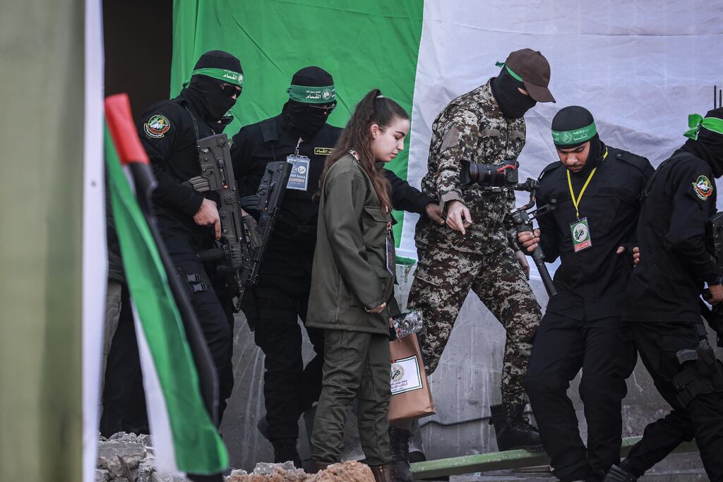 Israeli hostage Agam Berger with Hamas militants at Jabalia camp, northern Gaza prior to her release as part of a prisoner exchange. Photographer: Ahmad Salem/Bloomberg
