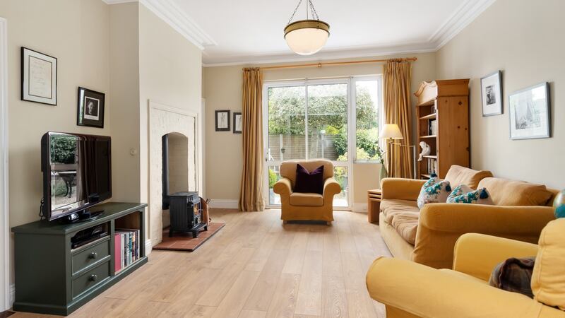 TV room with doors to back garden.