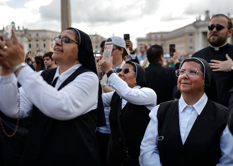 Nuns from Mexico watch and react in St Peter's Square as black smoke rises from the chimney of the Sistine Chapel. Photograph: Mario Tama/Getty Images
