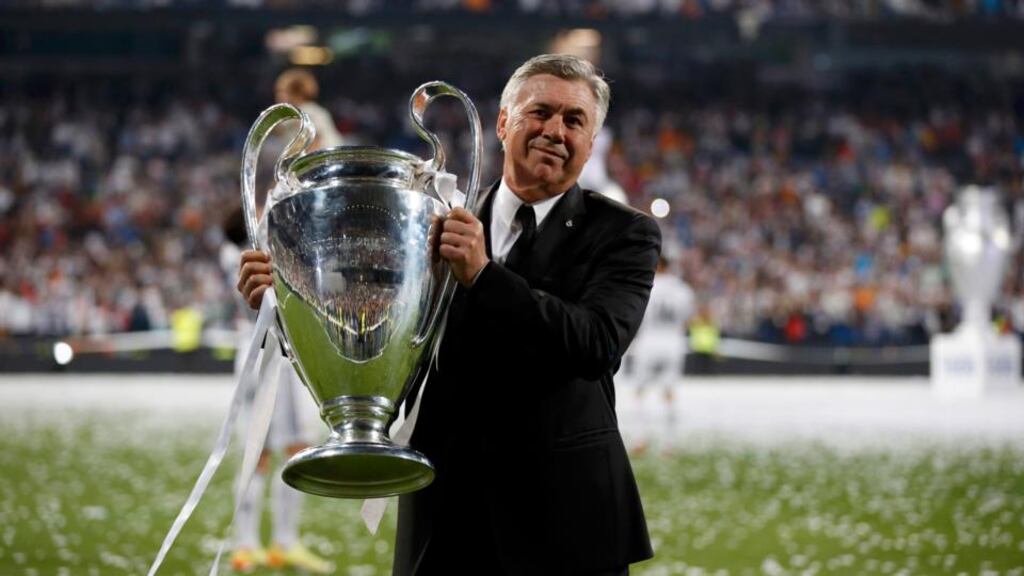Real Madrid coach Carlo Ancelotti poses with the Champions League trophy last weekend. Photograph: Paul Hanna/Reuters
