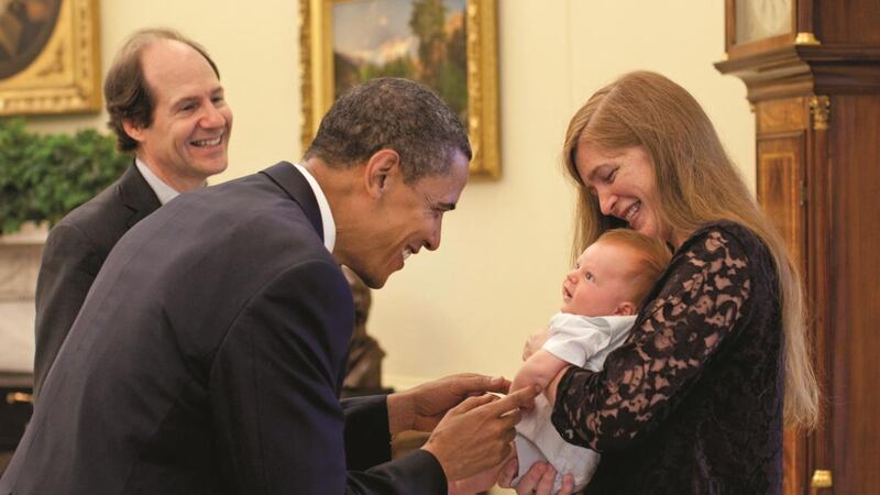 Fly-on-the wall insight: Samantha Power introduces her two-month-old son, Declan, to Barack Obama in the Oval Office in 2009, watched by her husband, Cass Sunstein. Photograph: Pete Souza/White House