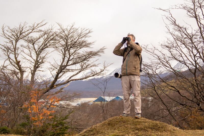 Esteban Daniels, an Argentine tourist guide specialising in birdwatching and nature photography, observes birds
at a municipal landfill in Ushuaia, Tierra del Fuego province, Argentina. Photograph: CRISTIAN URRUTIA / AFP via Getty Images