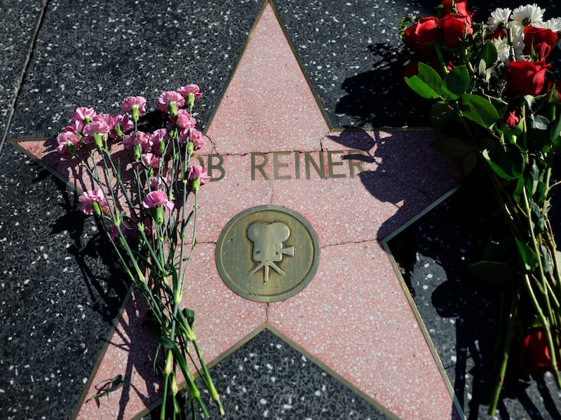 Flowers rest on director Rob Reiner's star on the Hollywood Walk of Fame in Los Angeles. Photograph: Mario Tama/Getty Images