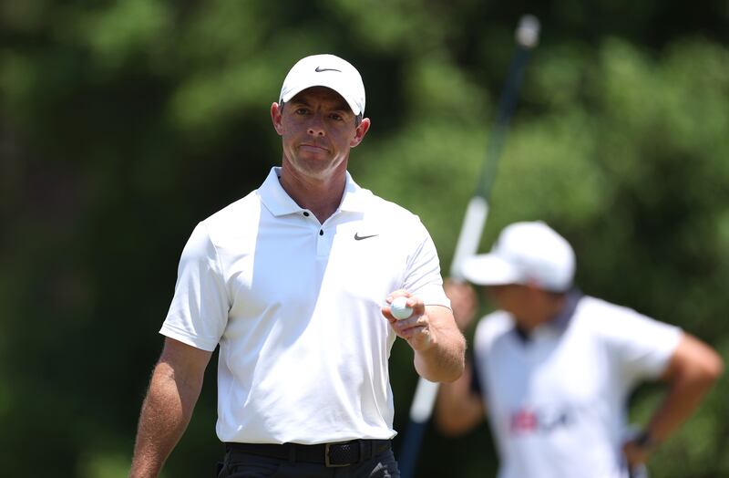 Rory McIlroy of Northern Ireland waves after putting on the eighth green. Photograph: Gregory Shamus/Getty