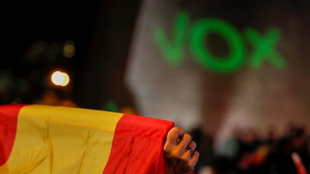 A supporter of Spain’s far-right party Vox holds a Spanish flag ahead of last month’s general election, at Colon square in Madrid. File photograph: Susana Vera/Reuters