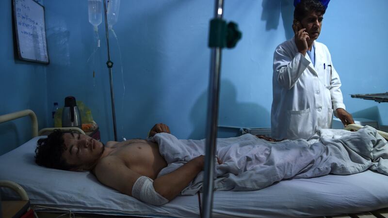 Wounded Afghan wrestler Ali Seena (20) receives treatment at Isteqlal hospital in Kabul after the September 6th attack. Photograph: Wakil Kohsar/AFP/Getty Images