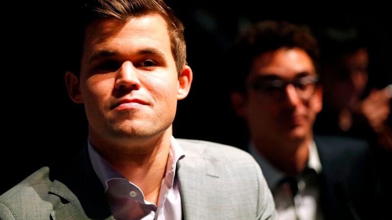 Magnus Carlsen with his  challenger Fabiano Caruana. Photograph: Tolga Akmen /AFP/Getty Images