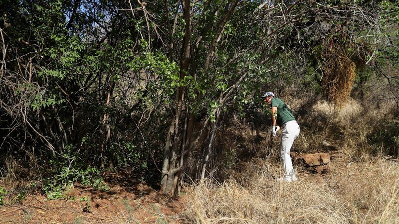 Rory McIlroy tries to play his way out of trouble during the final round in South Africa. Photograph: Warren Little/Getty