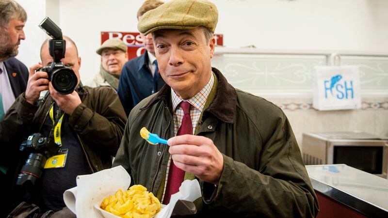 Brexit Party leader Nigel Farage  on a visit to a chip shop in Whitehaven. Photograph: Peter Powell