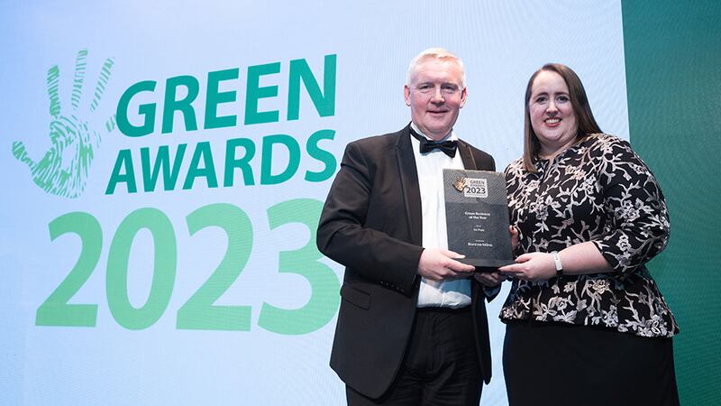 John Reilly, head of renewable energy, Bord na Móna, presents the Green Business of the Year award to Nicola Woods, An Post
