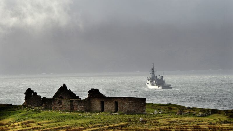 Irish Coast Guard helicopter crash: a naval vessel searches for the missing crew of Rescue 116.  Photograph: Dara Mac Dónaill