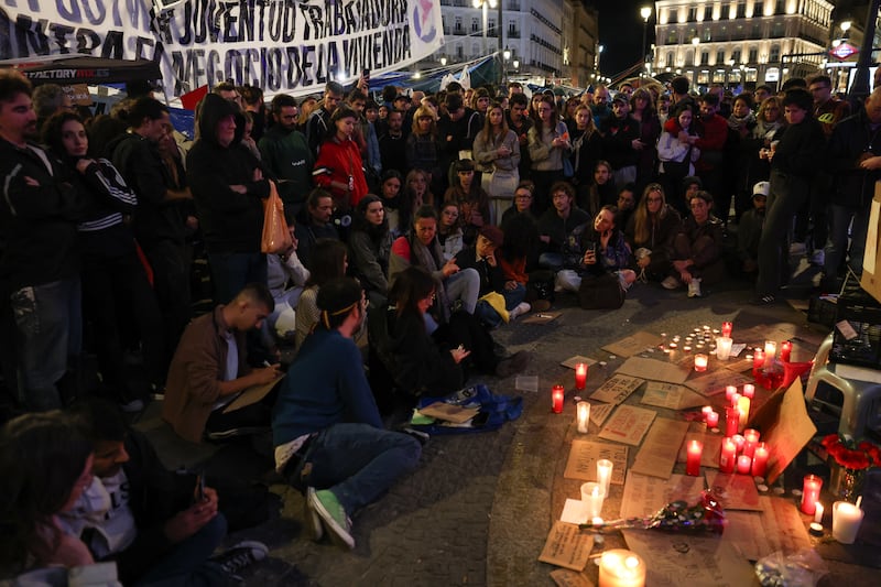 People gather for a vigil in the Puerta del Sol after learning that Maricarmen Abascal, the 87-year-old pensioner whose eviction triggered nationwide protests over Spain's chronic housing crisis, had died in hospital. Photograph: Thomas Coex/AFP via Getty Images