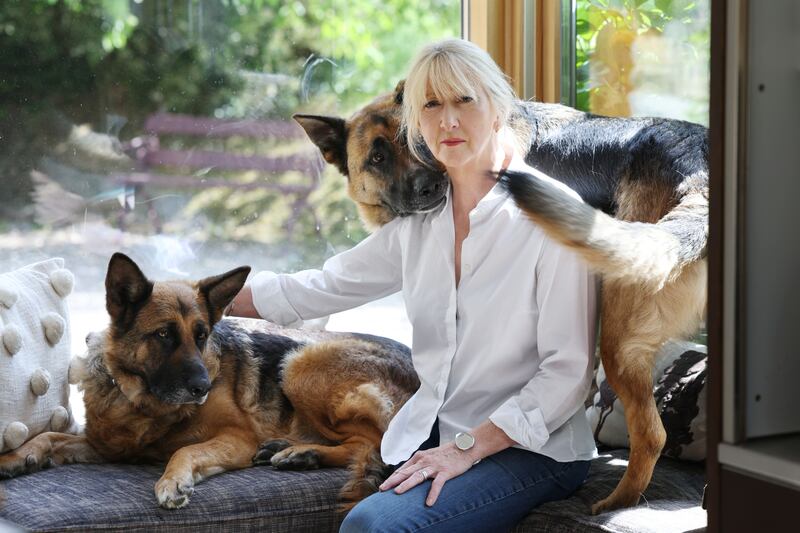 Karen McAnerney at the family home with her German shepherd dogs, Roxy and Theo. Photograph: Alan Betson
