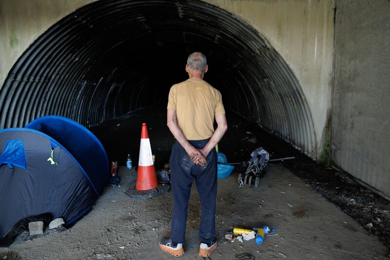 Philip, who has been long-term homeless, pictured with his belongings and tent.