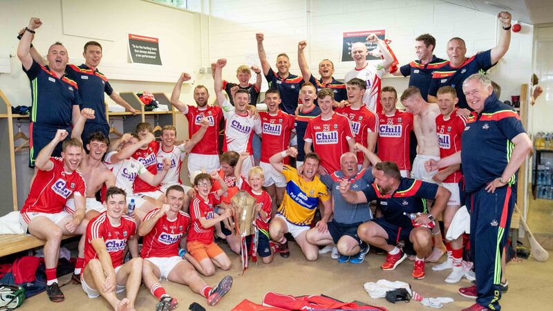 Cork players celebrate with the trophy in the dressingroom after their win over Clare at Semple Stadium in the 2018  Munster hurling final. Photograph: Morgan Treacy/Inpho