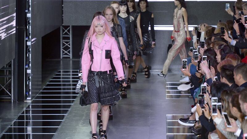 Creations in pink and black on the catwalk in the during the Louis Vuitton show at Paris Fashion Week. Photograph: Bertrand Guay/AFP/Getty
