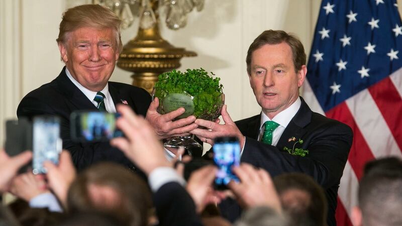 Taoiseach Enda Kenny presents President Donald Trump a traditional bowl of shamrocks during a St Patrick’s Day reception at the White House in Washington, March 16, 2017. Photograph: Al Drago/The New York Times