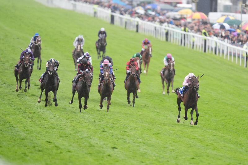 Christmas Day (right), ridden by Ronan Whelan, on the way to winning the Epsom Derby last Saturday. Photograph: Mike Egerton for The Jockey Club/PA Wire