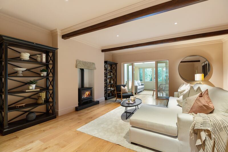 Living room at garden level of the property. Photograph: Angela Mujica